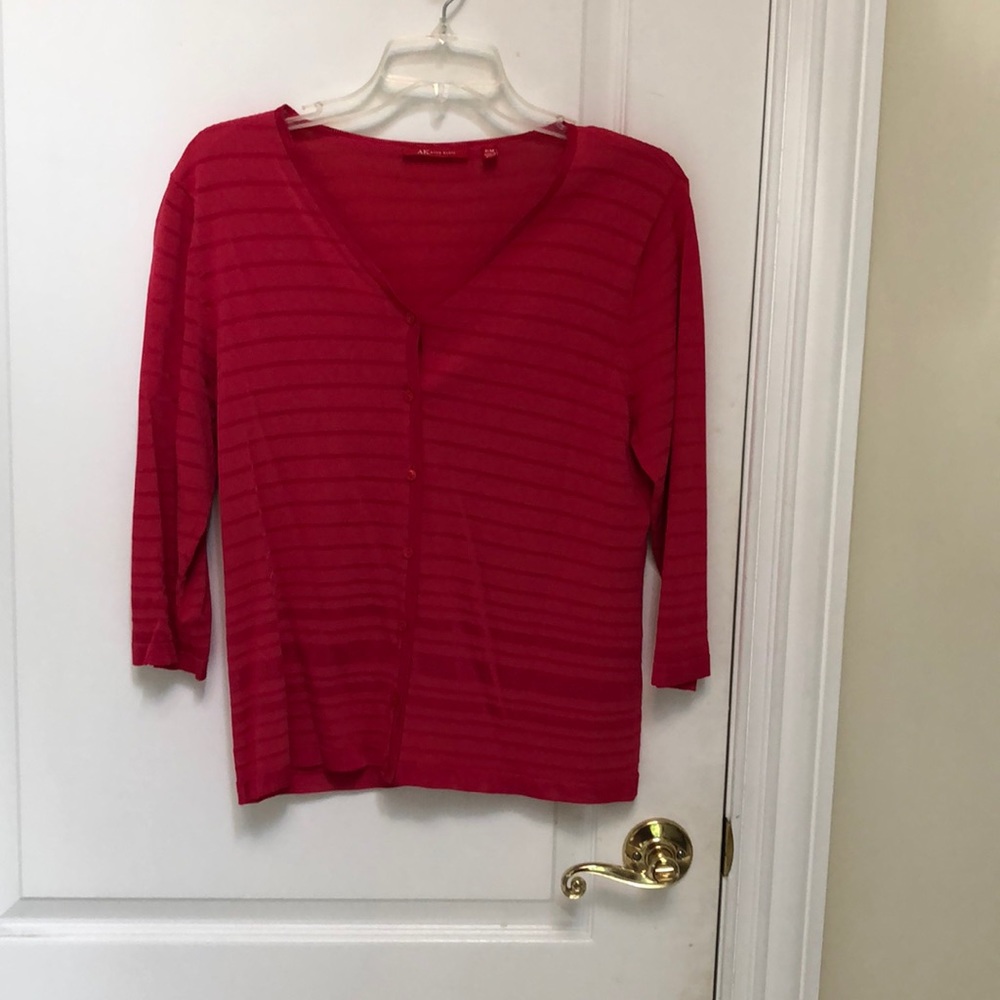 Dark pink sweater for spring with stripped design.